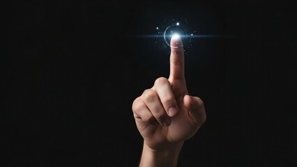 A human finger pressing a glowing circular button on black background
