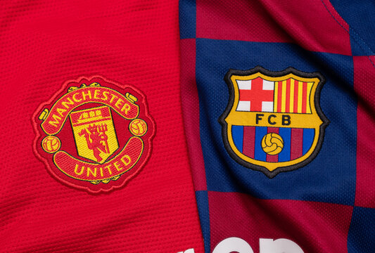 KYIV, Ukraine, January 9. Close-up of Manchester United and FC Barcelona logo side by side. Concept of football rivalry, Champions League, and global soccer fandom.