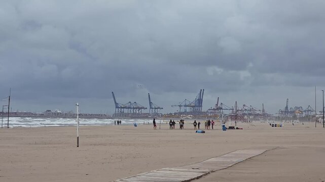 Valencia, Spain  - 25 October 2025 - view of Malvarrosa Beach (Platja de la Malva-rosa) is Valencia's most famous urban beach at a cloudy day 