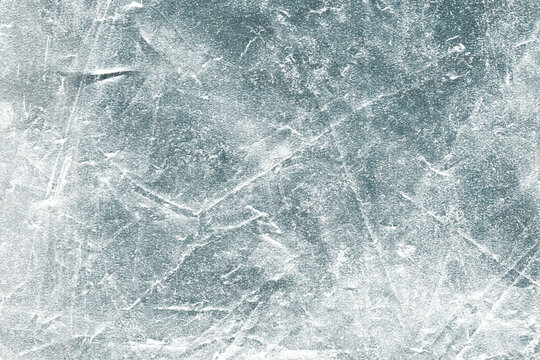 Scratched ice surface effect background. Abstract frozen grunge texture.