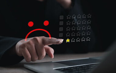 Negative customer feedback and low rating concept with dissatisfied icon and star review selection on digital interface for service evaluation.