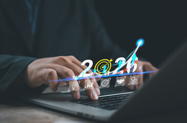 Business growth concept showing upward chart, target icons, and year 2026 above a laptop keyboard. Represents strategy, performance analysis, productivity improvement, planning, and long term business