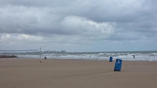 view of Malvarrosa Beach (Platja de la Malva-rosa) is Valencia's most famous urban beach at a cloudy day 
