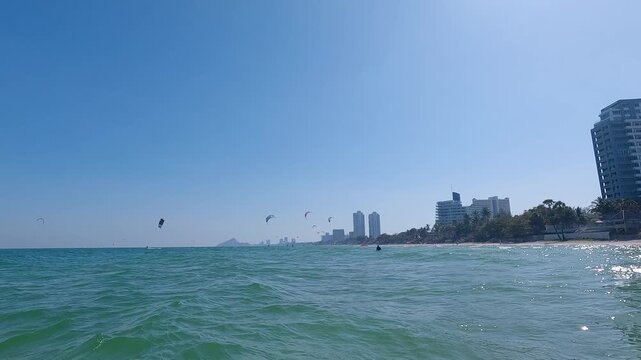Kiters are having fun in a good wind at the famous Kite Beach in Hua Hin, Thailand