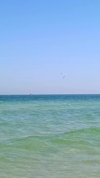 Kiters are having fun in a good wind at the famous Kite Beach,