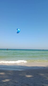 Kiters are having fun in a good wind at the famous Kite Beach,