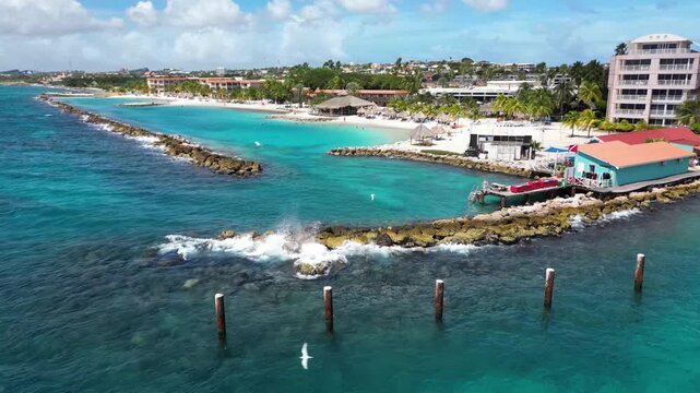 Aerial 4K Drone Footage of Mambo Beach (Seaquarium Beach) with Turquoise Waters and Rocky Bay in Cura&ccedil;ao, Caribbean