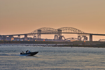 The Sault Ste. Marie International Bridge over St Marys River on the USA/Canada border at sunset