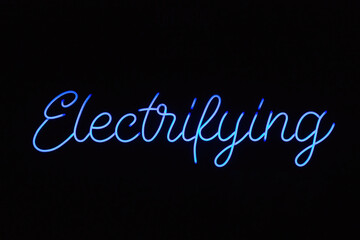 electrifying blue neon sign against a dark background