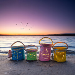travel the world - maritime lanterns with candle at the beach in sunset