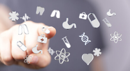 Abstract image representing medicine and health with floating icons being touched by a finger. Health care, me
