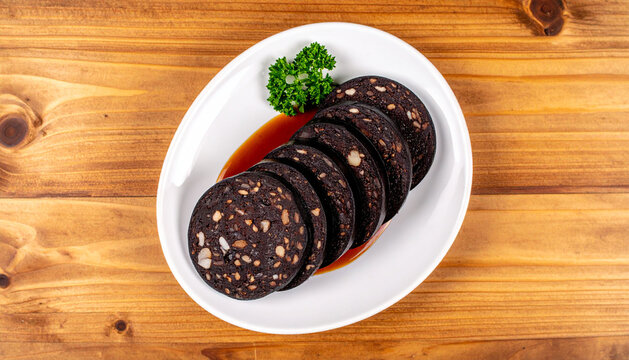 Sliced Black Pudding on White Plate