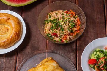 Couscous with dried fruits and turmeric, baked whole chicken