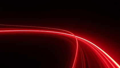 Vibrant red light trails on dark background create dynamic energy
