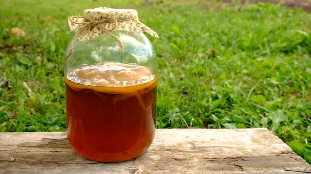 Kombucha in a jar at home. Selective focus.