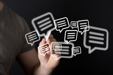 Obraz premium A person's hand interacting with floating digital message icons, representing communication, social media, and online interaction. Isolated on a
