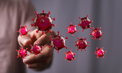 Abstract and conceptual illustration about the virus interacting with the human hand, medical concept of the t