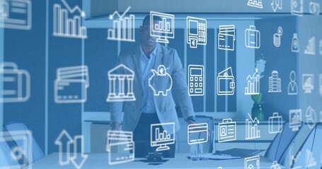 Presenting mid-adult man in light blazer reviewing papers at conference table, with finance overlay