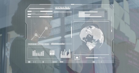 Analyzing two women in blazers wearing face masks interacting at office, with HUD charts and stylus