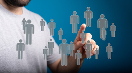 Man's finger touches virtual people network concept, representing human interaction and connection online.