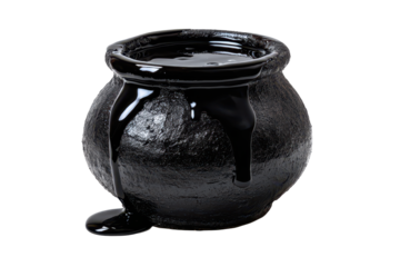 Black cauldron pot filled with glossy dark liquid and a slight spill at the rim isolated on transparent background.
