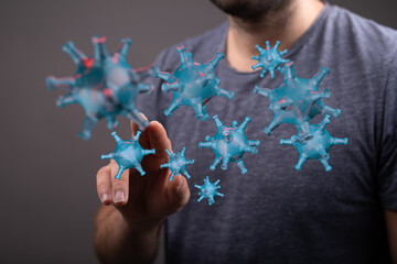 Conceptual image of a man interacting with a digital representation of a coronavirus, symbolizing the global p