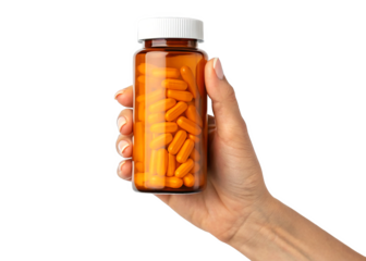 hand holding pill bottle with orange capsules isolated on a transparent background.