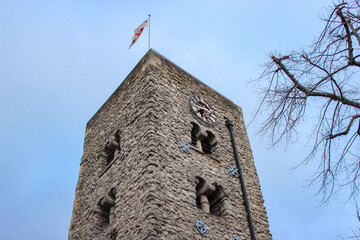 Saxon Tower of St Michael at the North Gate in Oxford. The square tower features two levels of twin-arched windows with small columns in the Anglo-Saxon architectural style.