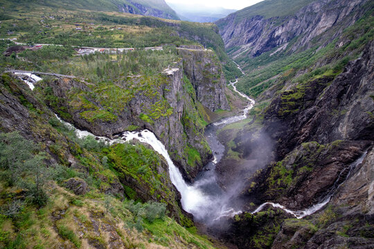 V&oslash;ringsfossen Falls, Norway. The V&oslash;ringsfossen Waterfall has a free fall of 145 metres and a total fall of 182 metres, and is one of the most visited tourist attractions in Norway.