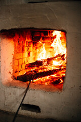 A cozy fireplace with a roaring fire