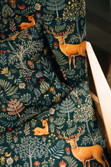 Upholstery of a chair with fabric with deer