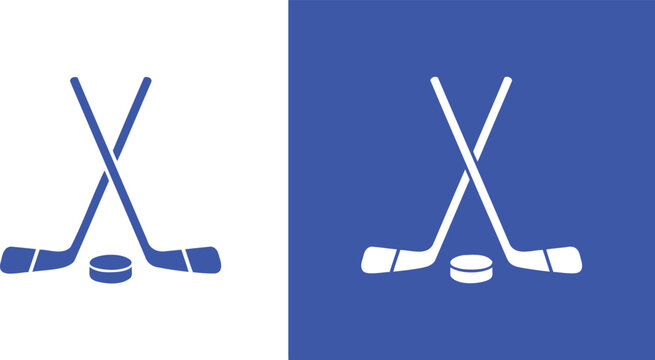 Two blue hockey sticks crossed with a puck sport game