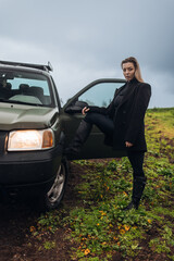 Young Woman in Old SUV car on a Farm