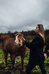 Young Woman with Horse in Autumn Nature