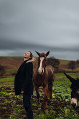 Young Woman with Horse in Autumn Nature