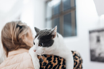 Female with Pet Cat in Her Arms