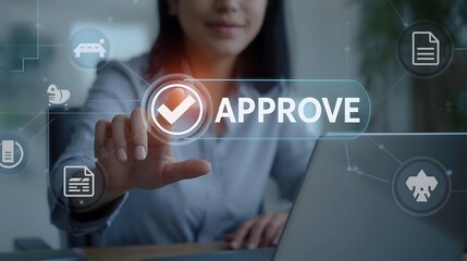 Woman touching approve button on digital interface with laptop