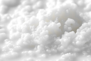 A close-up view of a pile of white fluffy material with a soft and serene texture , color of the year 2026, cloud dancer