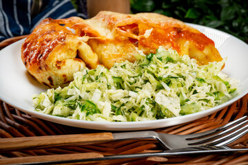 Stuffed pancake baked with cheese.