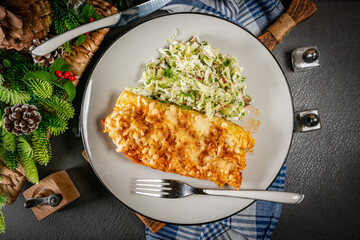 Stuffed pancake baked with cheese.