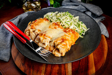 Stuffed pancake baked with cheese.