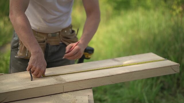 Carpentry. Tape measure. Wooden board.slow motion video. High quality video in FullHD format.