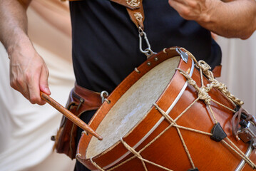 Musician playing a traditional wooden drum the concept of rhythm and music