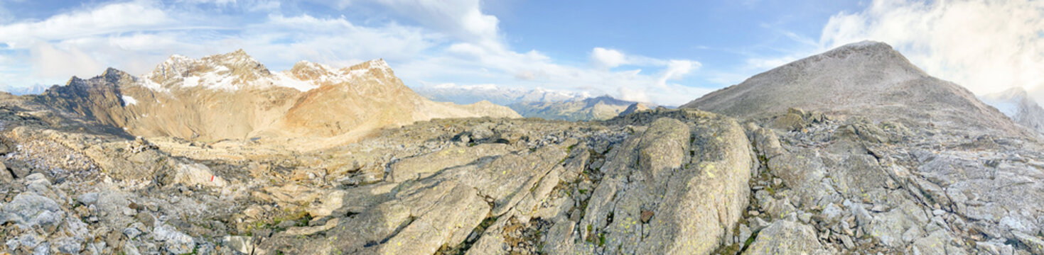 Hiking through the magnificent high mountain landscape with peaks and glaciers of the South Tyrolean Alps in the Antholz Valley near Bruneck, Rieserferner area of ​​the Dolomites, South Tyrol, Italy