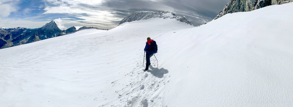 Hiking through the magnificent high mountain landscape with peaks and glaciers of the South Tyrolean Alps in the Antholz Valley near Bruneck, Rieserferner area of ​​the Dolomites, South Tyrol, Italy