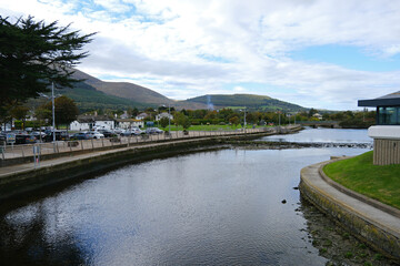 Fototapeta premium Panoramic view of the Shimna River and Mourne Mountains in the seaside town of Newcastle, County Down, Northern Ireland
