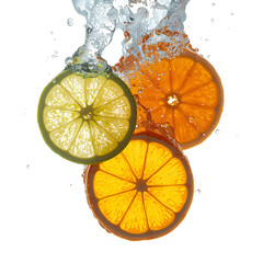 photograph of fresh citrus slices falling into clear water