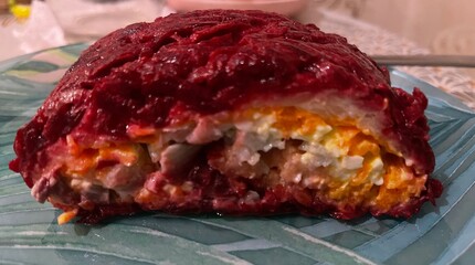 Herring under a fur coat, herring in a roll with carrots, boiled egg, beets, and boiled potatoes, all smeared with sauce, homemade food, cooking deliciously at home, holiday food, delicious, cooking