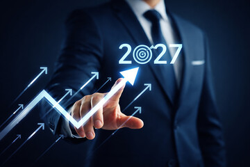Businessman pointing at rising arrow leading to 2027 target icon among multiple arrows representing strategic focus and leadership in corporate business development