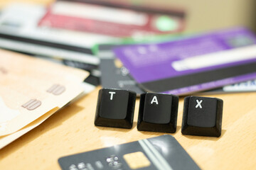 TAX season with keyboard alphabet key tax return file income tax concept illustration of financial...